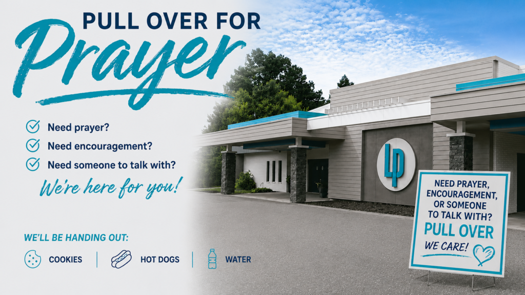 Front of church building with "Pull Over for Prayer" written on it